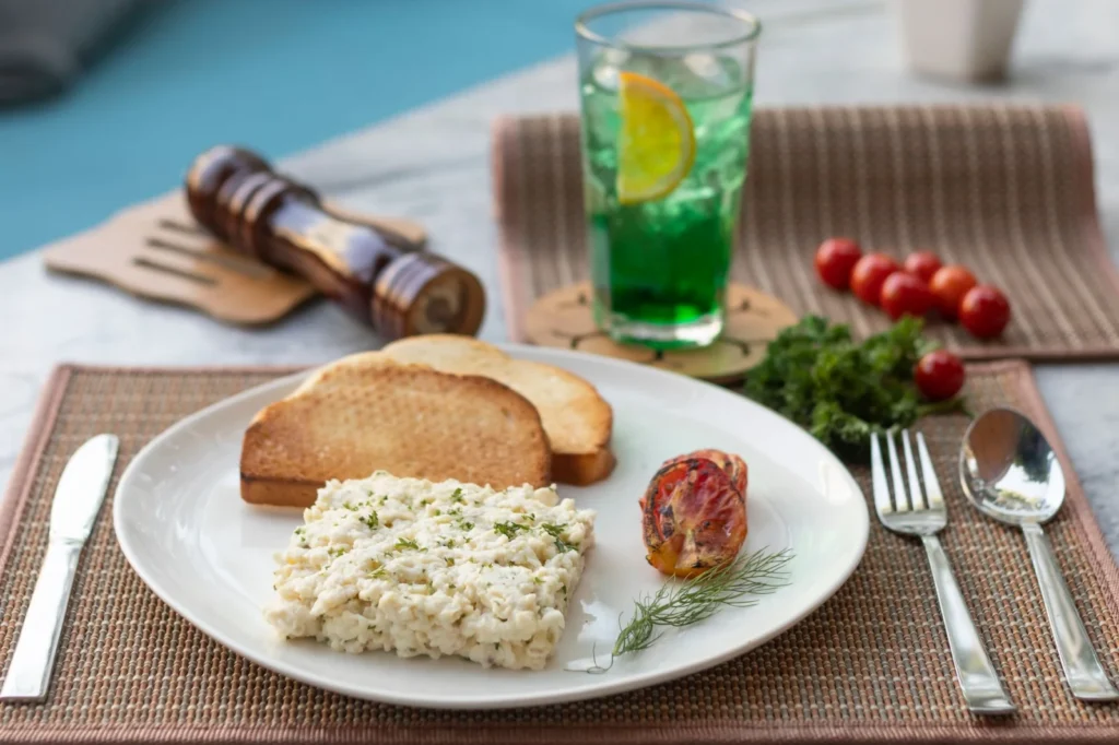 Appetizing breakfast setup featuring toast, creamy salad, and refreshing drink.